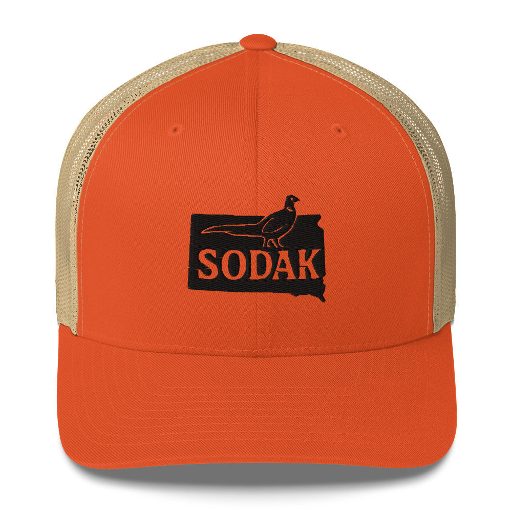Blaze-orange SODAK Pheasant Trucker hat with tan mesh back, featuring South Dakota design.